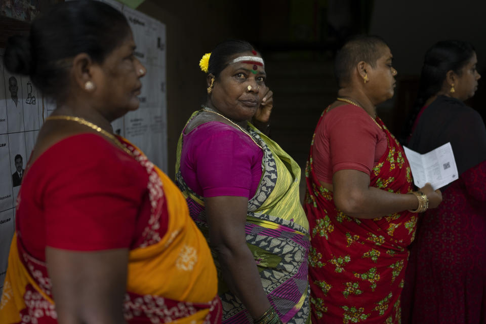 Women queue up to cast their votes during the first round of polling of India’s national election in Chennai, southern Tamil Nadu state, Friday, April 19, 2024. Nearly 970 million voters will elect 543 members for the lower house of Parliament for five years, during staggered elections that will run until June 1. (AP Photo/Altaf Qadri)