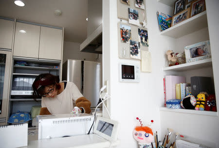 Kanako Hagiwara works in the kitchen of her house at Higashinohara district in Inzai, Chiba Prefecture, Japan, November 7, 2018. REUTERS/Kim Kyung-Hoon