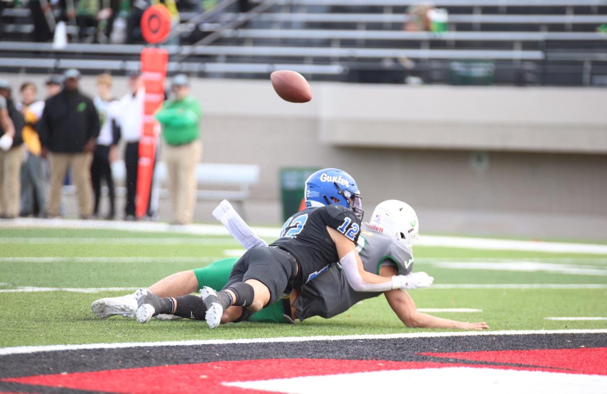 Gunter's Ivy Hellman forces a fumble on a sack of Dublin's Chris Teten in the Tigers' region semifinal victory.