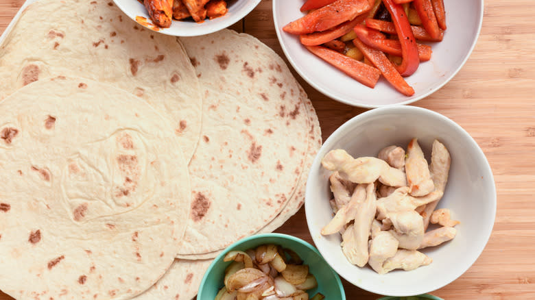 browned tortillas and taco ingredients