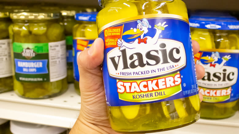 Hand holding Vlasic pickle jar