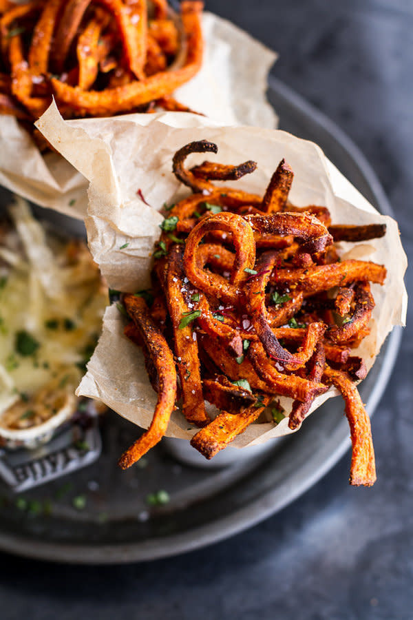 <strong>Get the <a href="http://www.halfbakedharvest.com/skinny-tandoori-butter-sweet-potato-fries-wcreamy-baked-harissa-feta/">Skinny Tandoori Butter Sweet Potato Fries with Creamy Baked Harissa Feta recipe</a>&nbsp;from Half Baked Harvest</strong>