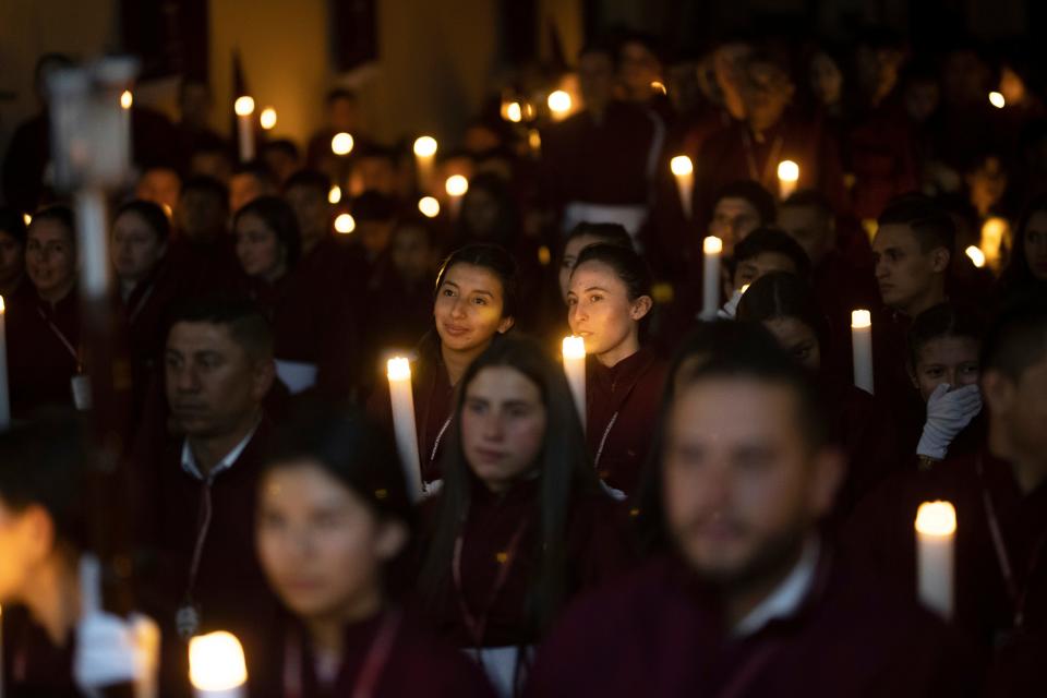 Members of the Nazarene brotherhood gather to pray before the Holy Thursday procession in Zipaquira, Colombia, April 6. Colombia isn't the only war zone in which journalists struggle to cover the complex role that religion plays in terrifying events that rarely create First World headlines.