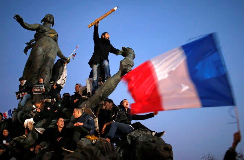 FILE PHOTO: A man takes part in a march in Paris following the shooting at Charlie Hebdo magazine