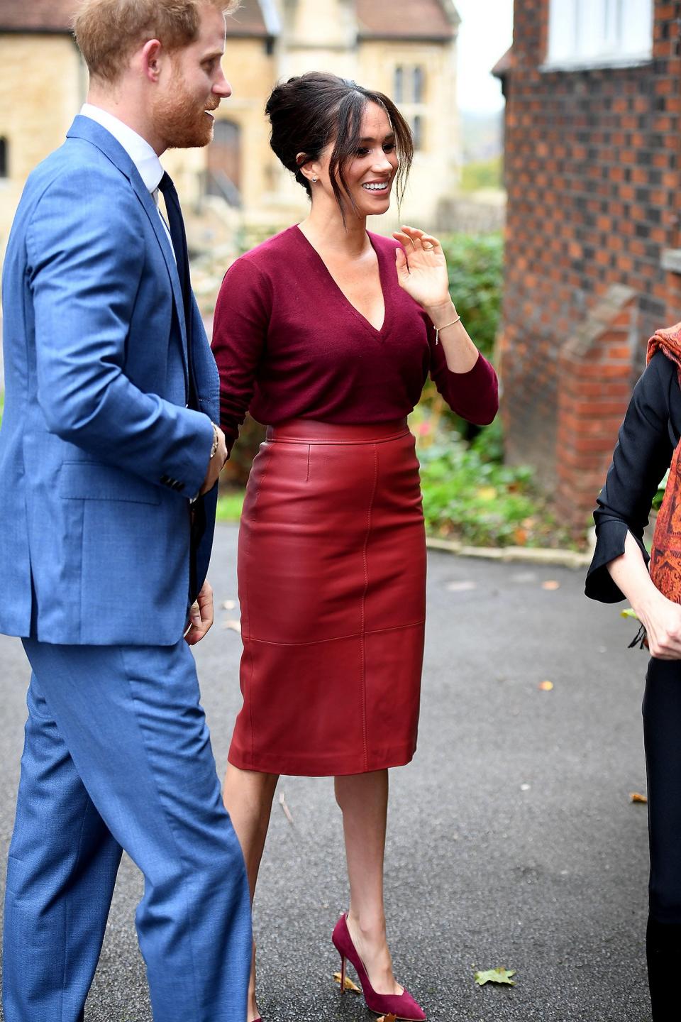 The Duchess of Sussex rocked the perfect autumnal outfit — a red leather pencil skirt from Hugo Boss and a matching burgandy sweater — for a roundtable discussion on gender equality with The Queens Commonwealth Trust at Windsor Castle in October. 