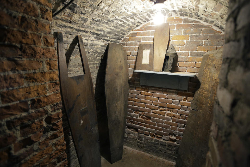 In this Wednesday, Nov. 7, 2018 photo tops of coffins sit in an empty crypt in the basement of Old North Church, in Boston. A memorial honoring fallen soldiers from the U.S. and Britain is being dedicated this month at an ironic venue - the Boston church where America's war for independence from England basically began. On Nov. 17, British and American military brass will unveil a bronze wreath and plaque at Old North Church, saluting troops from both countries who have died in Iraq and Afghanistan. (AP Photo/Steven Senne)