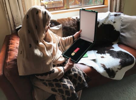 Ambreen Naeem holds a medal which was posthumously awarded to her husband Mian Naeem Rashid for bravery, after being killed charging the attacker at an attack on Al Noor mosque in March in Christchurch, New Zealand