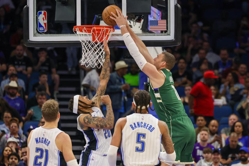 Bucks center Brook Lopez dunks over Magic guard Markelle Fultz on Tuesday night. Lopez scored a team-high 26 points.