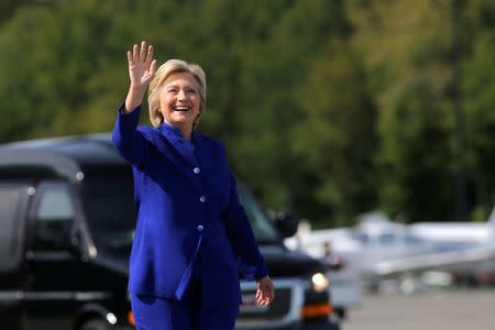 U.S. Democratic presidential candidate Hillary Clinton waves as she boards her campaign plane at the Westchester County airport in White Plains, New York, U.S., September 21, 2016. REUTERS/Carlos Barria