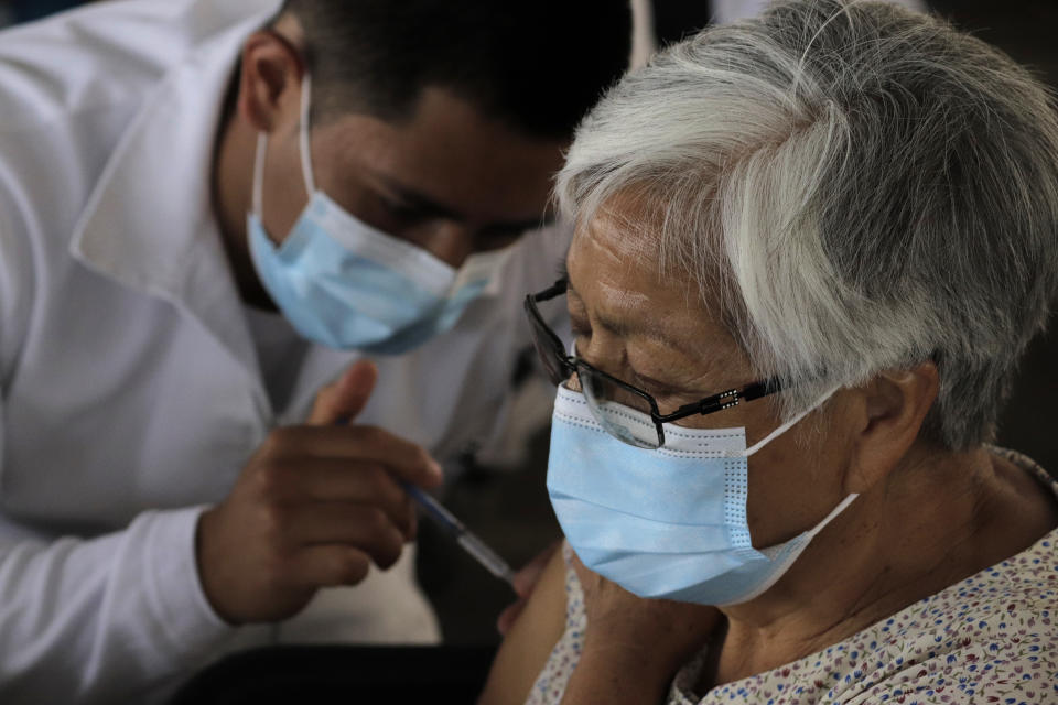 Medical personnel immunize older adults with the Sputnik V biological vaccine against COVID-19 inside the facilities of the Electric Transportation Service of Mexico City, during the sanitary emergency and the orange epidemiological traffic light in the capital. (Photo by Gerardo Vieyra/NurPhoto via Getty Images)