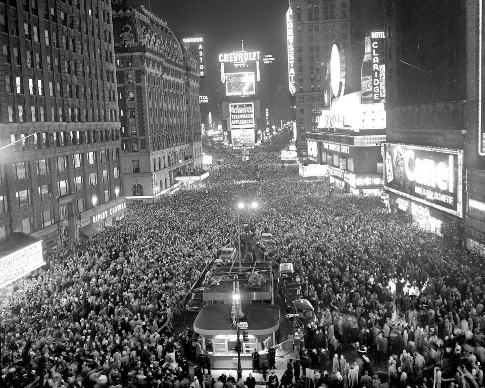 An estimated 350,000 revelers gather to welcome the new year in New York's Times Square, Jan. 1, 1958.