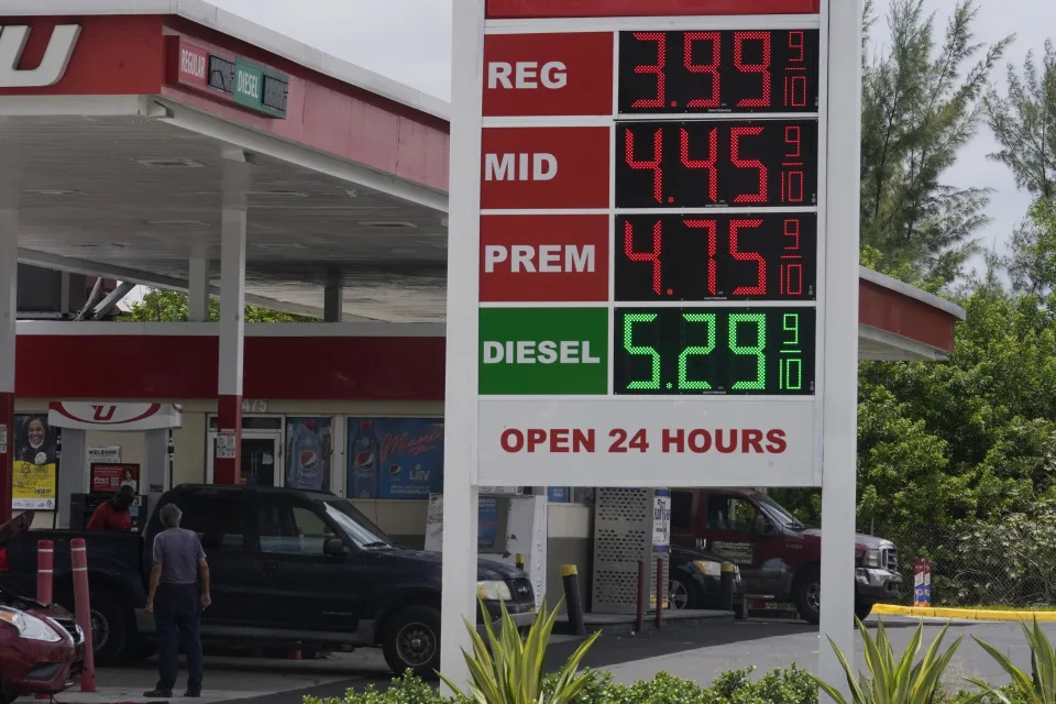 Customers fill up at a UGas gas station, Monday, July 18, 2022, in Opa-Locka, Fla. Gas prices continue to decline and some cities are seeing prices under $4 a gallon for regular unleaded gasoline. (AP Photo/Marta Lavandier)