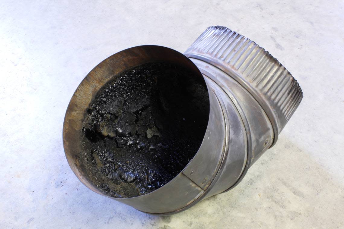A dangerous buildup of creosote in a stovepipe can cause a chimney fire. db_beyer/Getty Images/iStockphoto