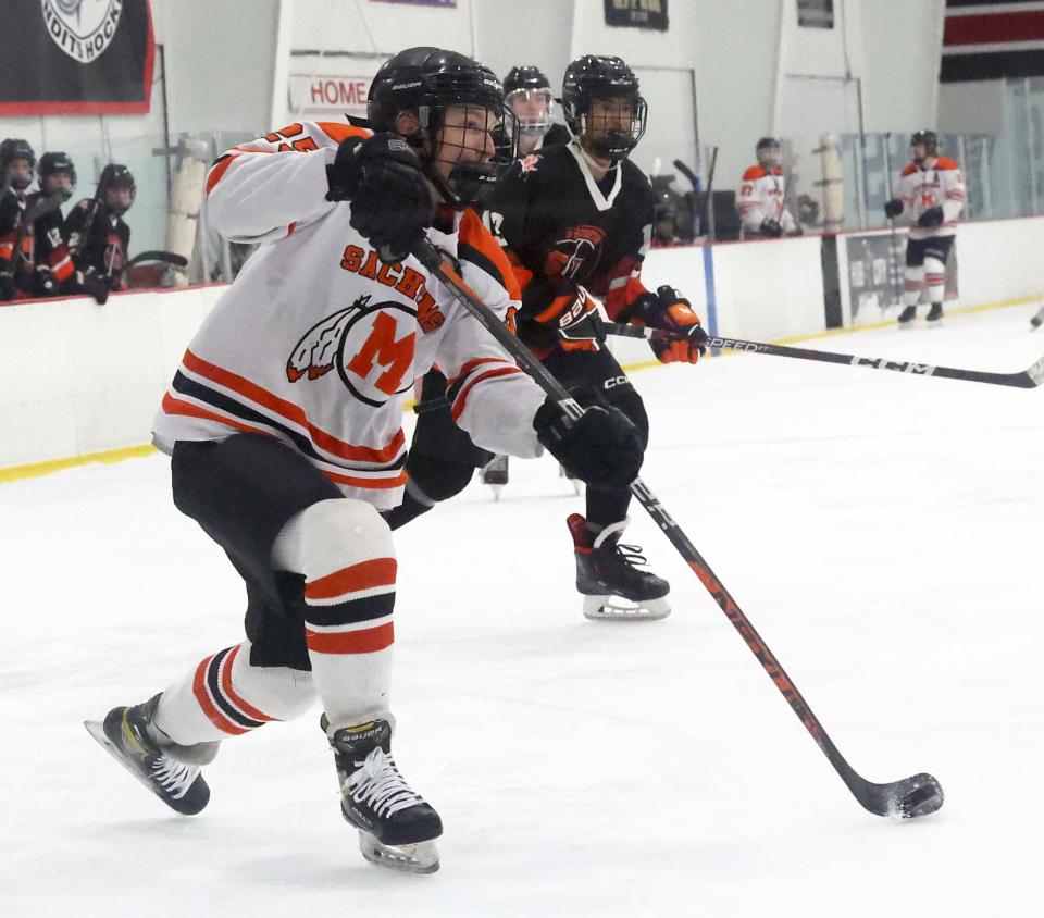 Middleboro/Carver/Wareham's Sam Steinman takes a shot on the Stoughton/Brockton net during a game at the Bridgewater Ice Arena on Wednesday, Jan. 4, 2023.