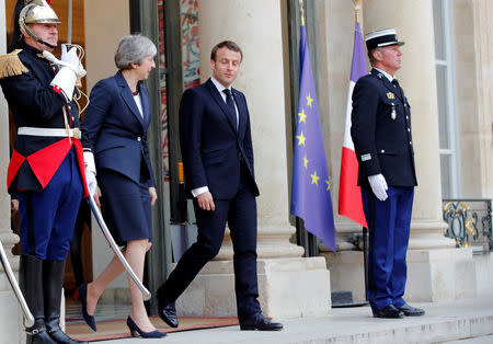 French President Emmanuel Macron and British Prime Minister Theresa May leave after a meeting to discuss Brexit, at the Elysee Palace in Paris, France, April 9, 2019. REUTERS/Philippe Wojazer