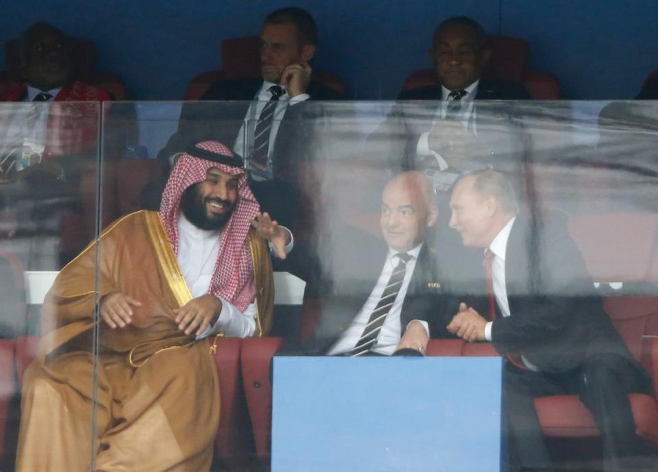 Saudi Arabia crown prince Mohammed bin Salman, Fifa president Gianni Infantino and Russian president Vladimir Putin at the World Cup in Moscow in 2018 (Associated Press)