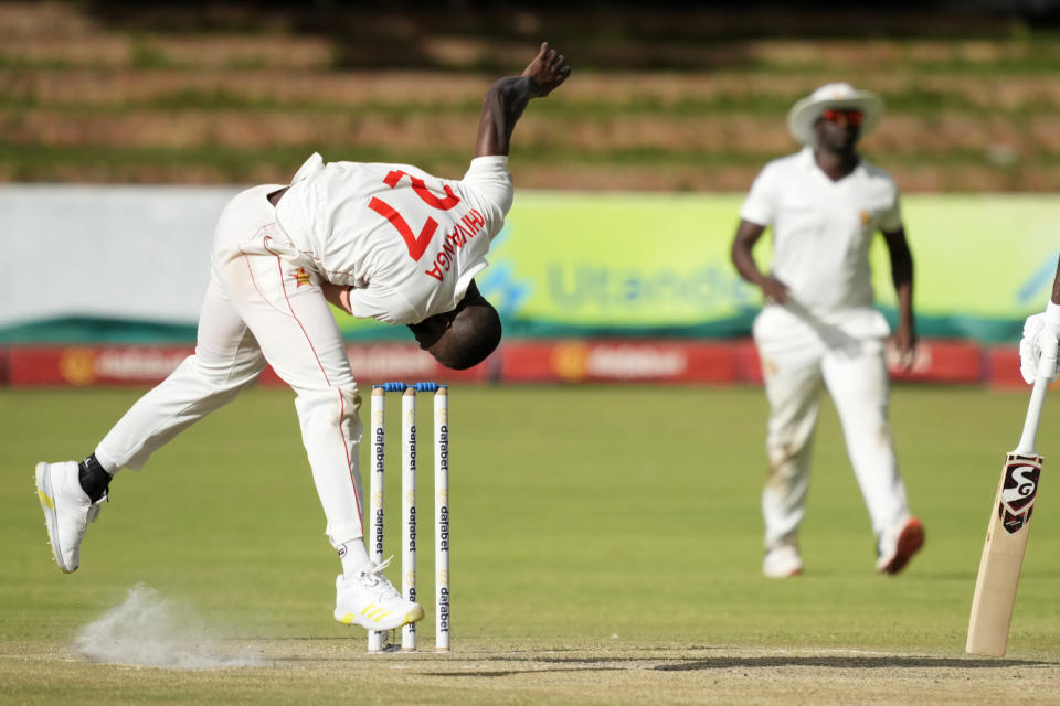 Zimbabwean bowler Tanaka Chivanga in action on the second day of the second Test cricket match between Zimbabwe and West Indies at Queens Sports Club in Bulawayo, Zimbabwe, Monday,Feb, 13, 2023. (AP Photo/Tsvangirayi Mukwazhi)