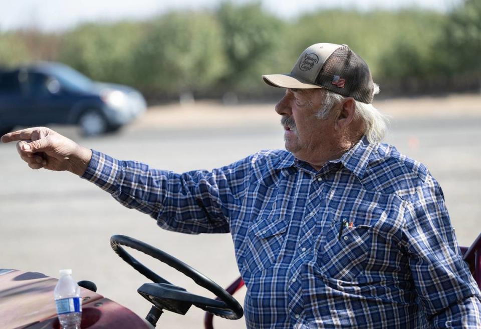 Rodin Farms’ Tony Rodin points to motor traffic near the Fruit Stand on Oakdale and Claribel roads near Modesto, Calif., Wednesday, Nov. 1, 2023.