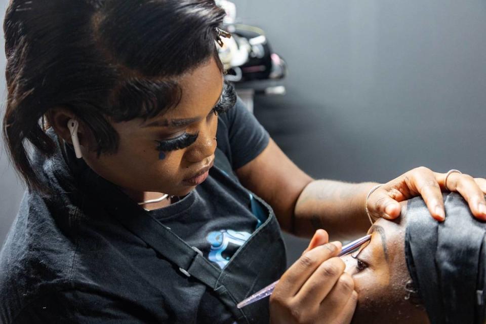 Evrose Myrtil (left) does Precious-Nicole Beverly’s (bottom right) makeup before the South Florida Fashion Academy’s Second Annual Student Fashion Show at the L.A. Lee YMCA/Mizell Community Center on Friday, June 7, 2024, in Fort Lauderdale, Florida.