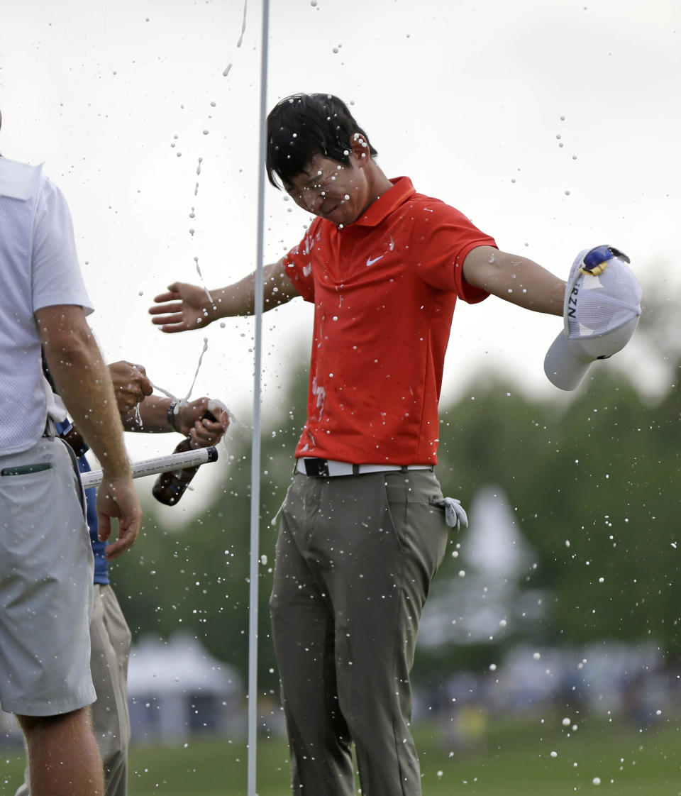 Noh Seung-yul, of South Korea, is doused with beer on the 18th green after winning the Zurich Classic golf tournament at TPC Louisiana in Avondale, La., Sunday, April 27, 2014. (AP Photo/Bill Haber)
