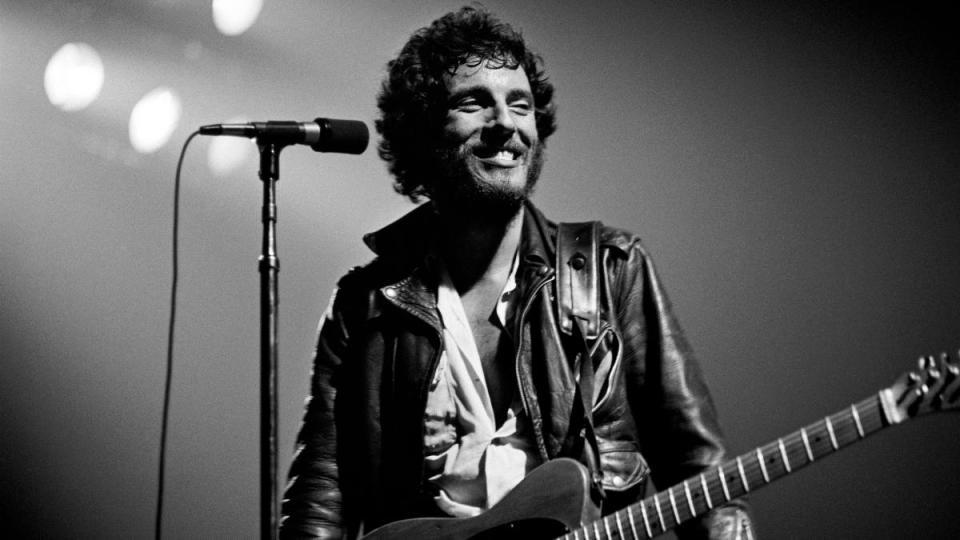 Bruce Springsteen with a guitar onstage