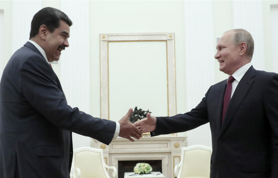 Russian President Vladimir Putin, right, shakes hands with Venezuela's President Nicolas Maduro during their meeting in the Kremlin in Moscow, Russia, Wednesday Sept. 25, 2019. Nicolas Maduro is on a working visit to Moscow. (Sergei Chirikov/Pool Photo via AP)