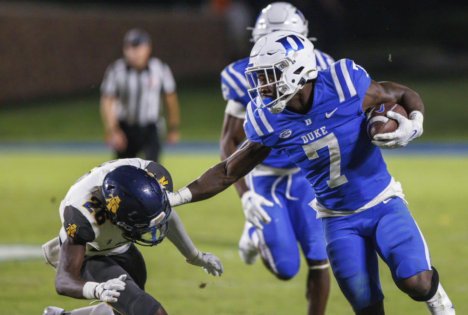 Duke's Jordan Waters (7) carries the ball past North Carolina A&T's Ty Williams Jr. (26) during the second half of an NCAA college football game in Durham, N.C., Saturday, Sept. 17, 2022. (AP Photo/Ben McKeown)