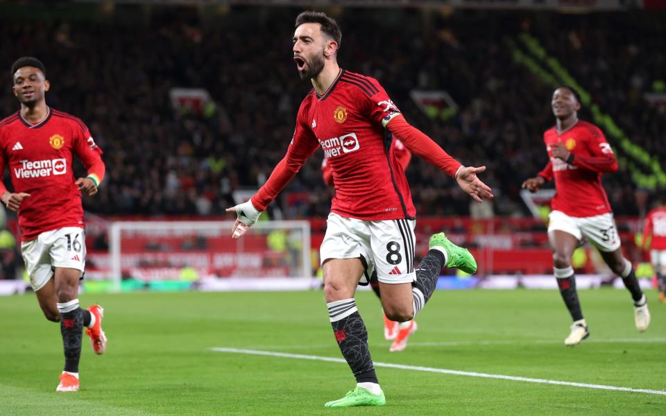 Bruno Fernandes of Manchester United celebrates scoring his team's third goal during the Premier League match between Manchester United and Sheffield United at Old Trafford on April 24, 2024 in Manchester, England.