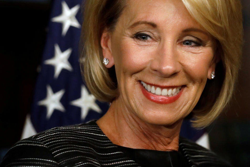 Betsy DeVos waits to be sworn-in as U.S. Education Secretary at the Eisenhower Executive Office Building at the White House in Washington, U.S. February 7, 2017. REUTERS/Jonathan Ernst     TPX IMAGES OF THE DAY