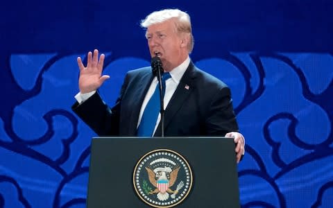 U.S. President Donald Trump speaks at the Asia-Pacific Economic Cooperation (APEC) CEO Summit at the Aryana Convention Center in Danang, Vietnam,  - Credit: AP