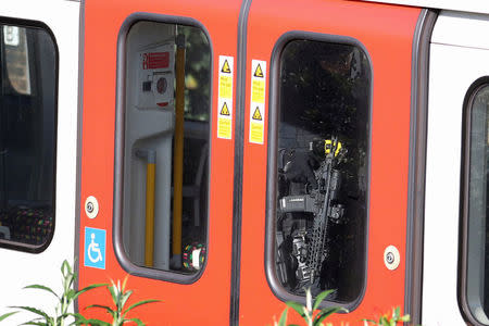 Armed police officers walk through a carriage of a London underground tube train at Parsons Green station in London, Britain September 15, 2017. REUTERS/Hannah McKay