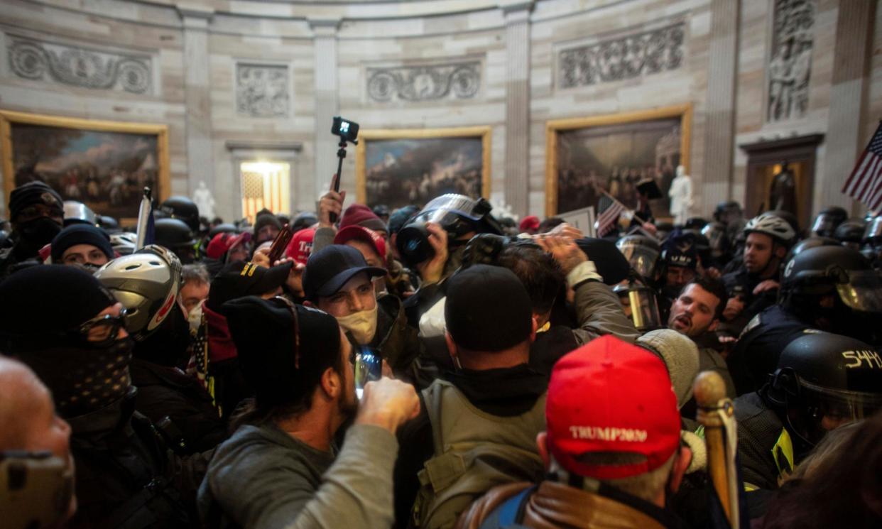 <span>‘Why was Trump allowed to spout his online misinformation? Was Twitter right to let him? Was it right to stop him?’: Trump supporters breach the US Capitol on 6 January 2021.</span><span>Photograph: Reuters</span>