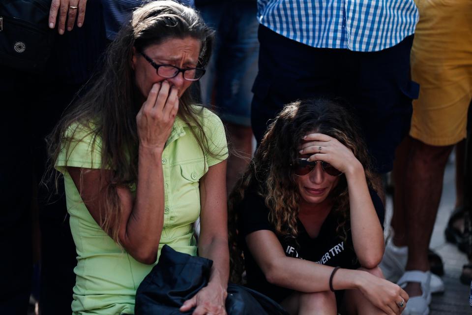 People gather to mourn at Las Ramblas, a tree-lined street popular with tourists, where&nbsp;a van drove into a group of people in the deadly Barcelona attack Thursday.