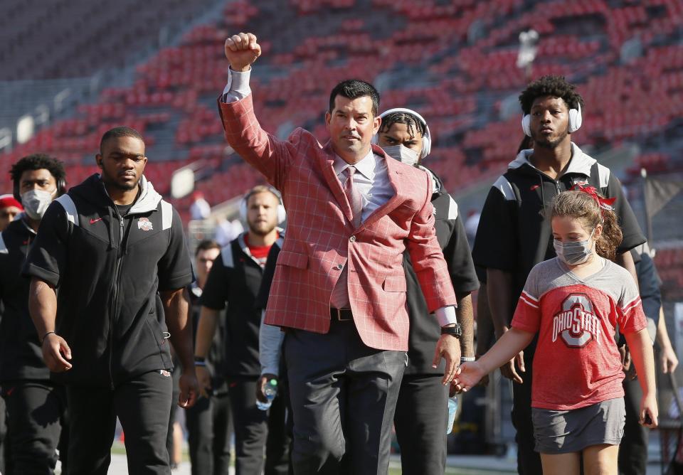 Ohio State Buckeyes head coach Ryan Day leads his team into Ohio Stadium prior to the NCAA football game against the Oregon Ducks in Columbus on Saturday, Sept. 11, 2021. 