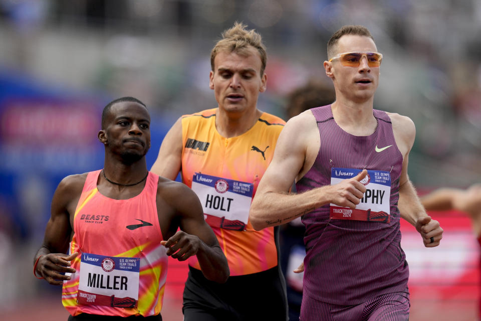 Clayton Murphy, Brandon Miller and Eric Holt finish a heat in the men's 800-meter during the U.S. Track and Field Olympic Team Trials Thursday, June 27, 2024, in Eugene, Ore. (AP Photo/Charlie Neibergall)