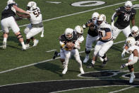 Cincinnati quarterback Desmond Ridder, front center, is sacked by Murray State linebacker Scotty Humpich during the second half of an NCAA college football game Saturday, Sept. 11, 2021, in Cincinnati. (AP Photo/Jeff Dean)