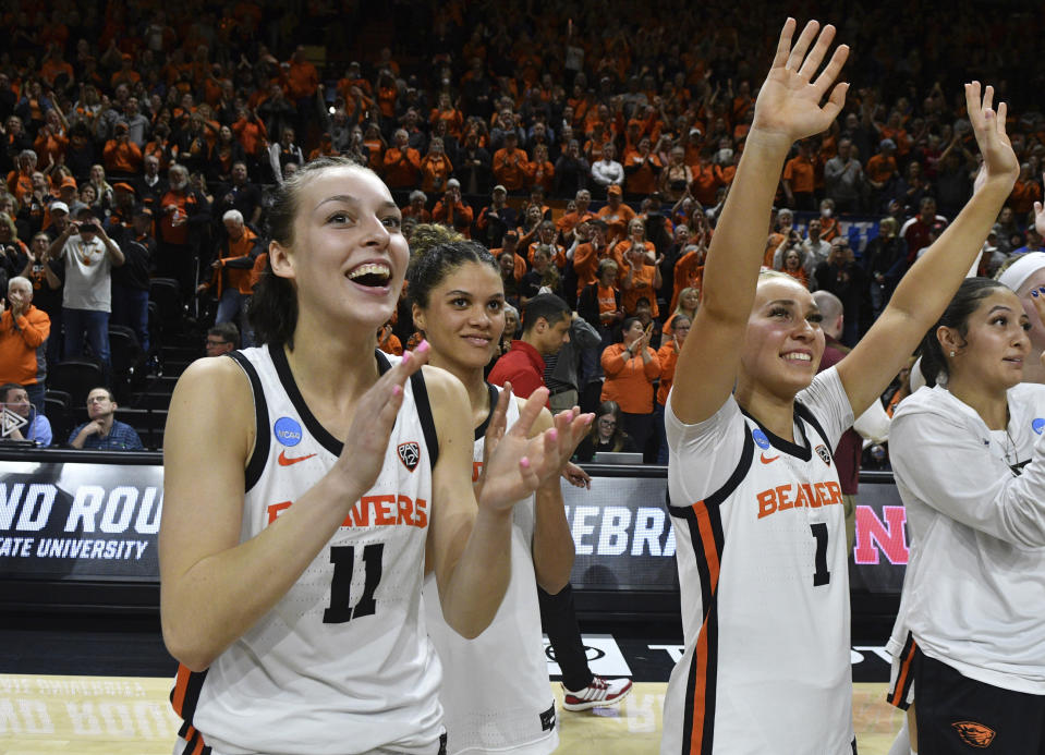 Oregon State guard AJ Marotte (11), guards Donovyn Hunter and Kennedie Shuler (1) thank the crowd after a game against Nebraska during the second half of a second-round college basketball game in the women's NCAA Tournament in Corvallis, Ore., Sunday, March 24, 2024. (AP Photo/Mark Ylen)