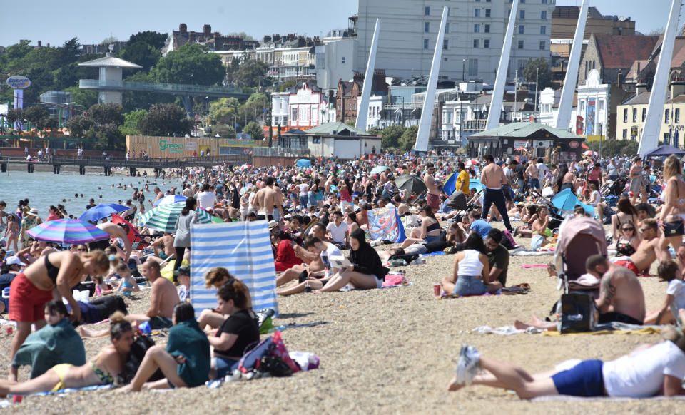 SOUTHEND-ON-SEA, ENGLAND - MAY 25: Crowds of people gather on the beach on a warm and sunny May Day bank holiday on May 25, 2020 in Southend-on-Sea, United Kingdom. The British government has started easing the lockdown it imposed two months ago to curb the spread of Covid-19, abandoning its 'stay at home' slogan in favour of a message to 'be alert', but UK countries have varied in their approaches to relaxing quarantine measures. (Photo by John Keeble/Getty Images)