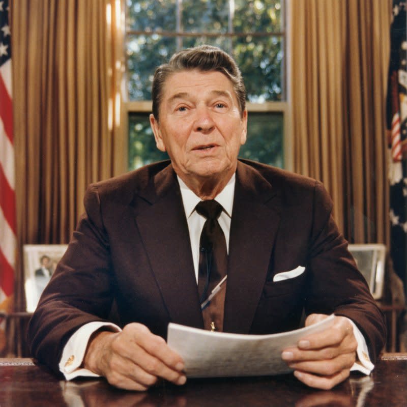 President Ronald Reagan addresses the nation via television on October 14, 1987. On March 4, 1987, Reagan acknowledged his administration swapped arms to Iran for U.S. hostages and said, "It was a mistake." File Photo by Tim Clary/UPI