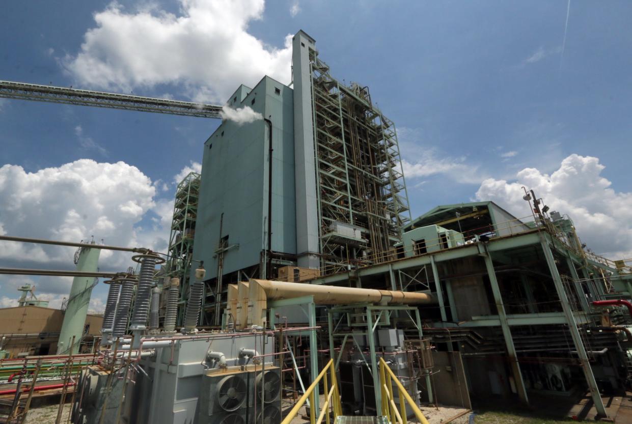 Unit 3 and its coal conveyor, top left, at Lakeland Electric's McIntosh Power Plant on Lake Parker Drive in Lakeland.  File Photo/The Ledger 2014