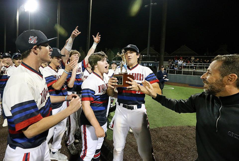 The Governor Livingston baseball team receives the trophy after beating Westfield to win the Union County Tournament championship on May 13, 2024