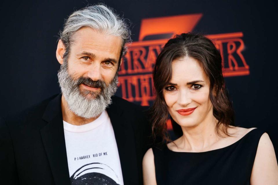 <p>Matt Winkelmeyer/FilmMagic</p> Scott Mackinlay Hahn and Winona Ryder on June 28, 2019