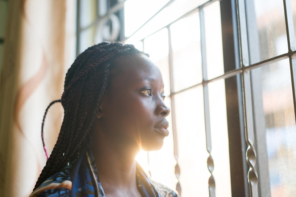 woman looking out the window