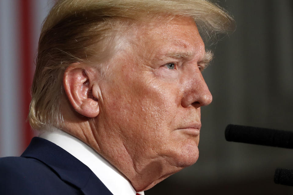 President Donald Trump listens during a news conference with British Prime Minister Theresa May at the Foreign Office, Tuesday, June 4, 2019, in central London. (AP Photo/Alex Brandon)