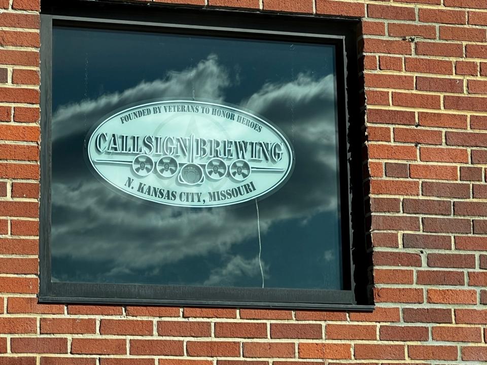 A neon sign for Callsign Brewing out of North Kansas City, Missouri, hangs in the window at RRACKSS. The barbecue restaurant and steakhouse plans to exclusively serve the Callsign beers.