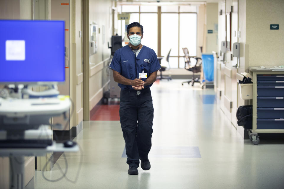 Neeraj Soni, M.D. walks through the emergency department at St. Luke's Boise Medical Center in Boise, Idaho on Tuesday, Aug. 31, 2021. Idaho Gov. Brad Little said during a news conference today that "nearly all Idaho hospitals are overwhelmed with unvaccinated COVID-19 patients," (AP Photo/Kyle Green)