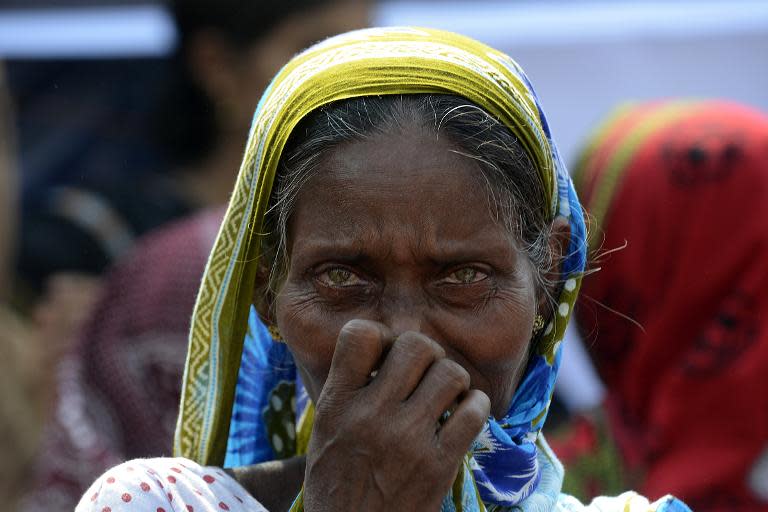 A Bangladeshi mourner and relative of a victim of the Rana Plaza building collapse reacts as she takes part in a protest marking the first anniversary of the disaster in Savar, on the outskirts of Dhaka, on April 24, 2014
