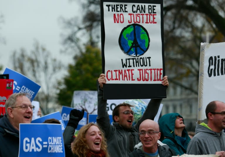 Protesters rally about climate change outside the White House in Washington, DC on November 29, 2015