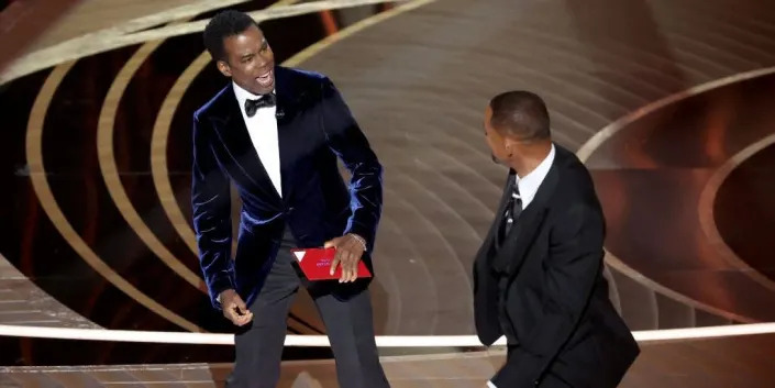 Chris Rock and Will Smith onstage at the 2022 Oscars