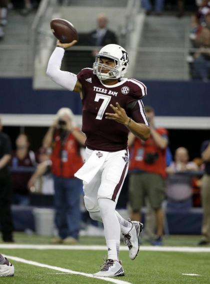 FILE - This Sept. 27, 2014, file photo, shows Texas A&M quarterback Kenny Hill passing in the first half of an NCAA college football game against Arkansas in Arlington, Texas. (AP Photo/Tony Gutierrez, File)